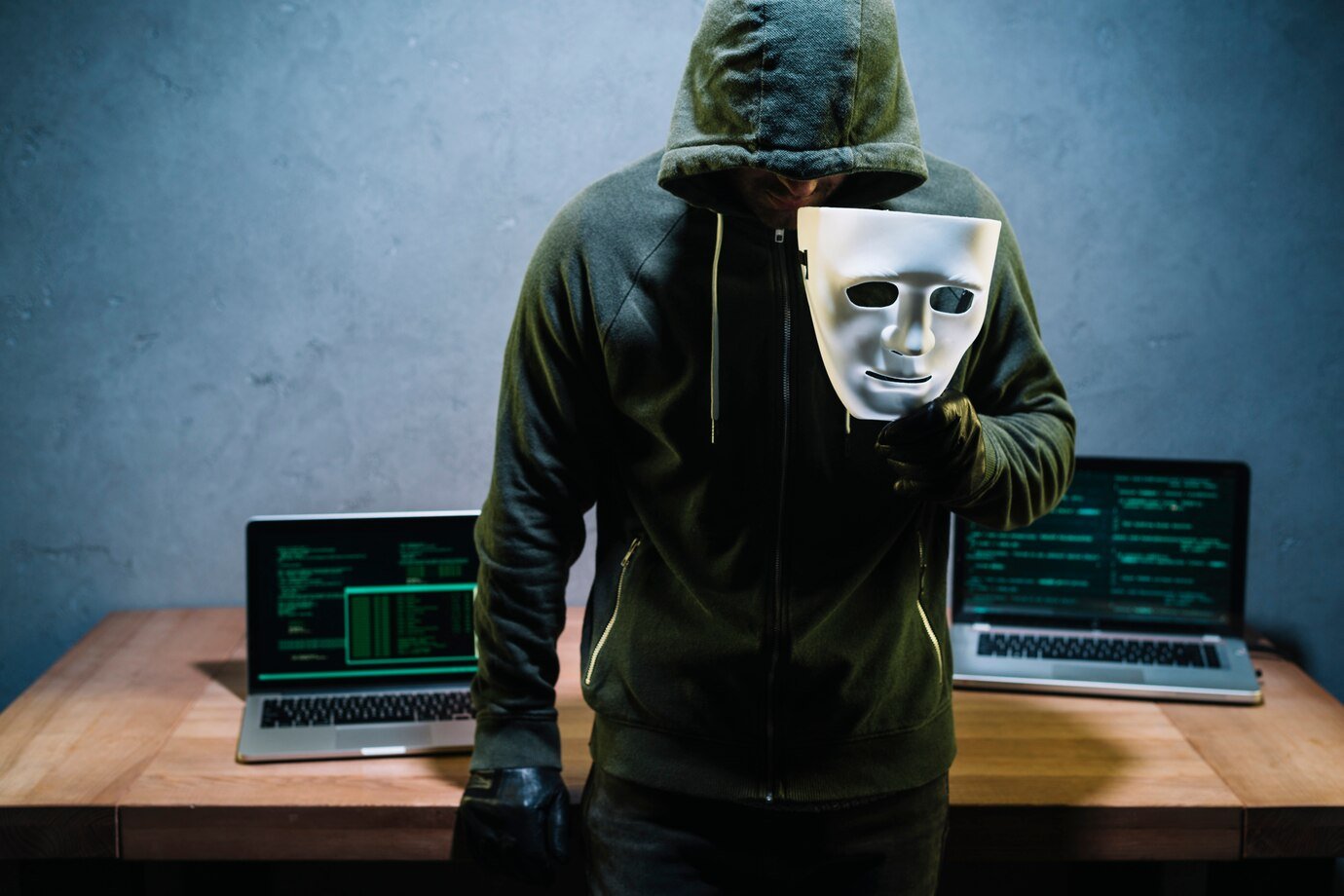 hacker holding mask 23 2147985362