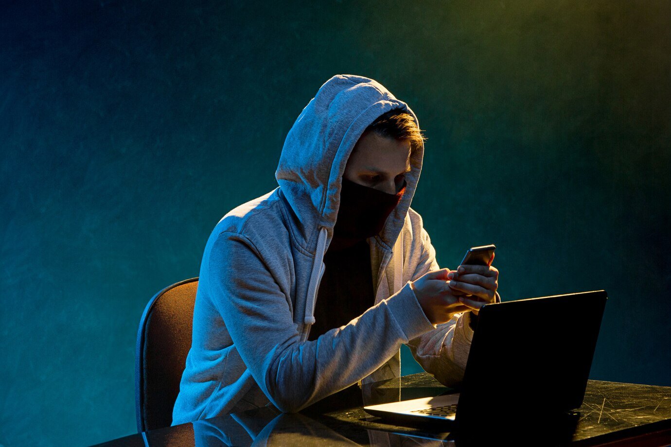 hooded computer hacker stealing information with laptop 155003 10567